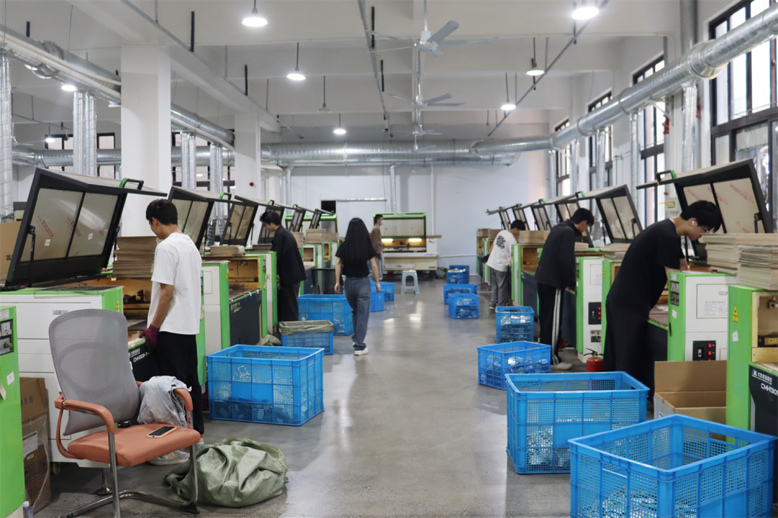 Factory floor with production workers and equipment.
